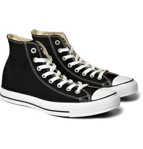 high top black canvas shoes.